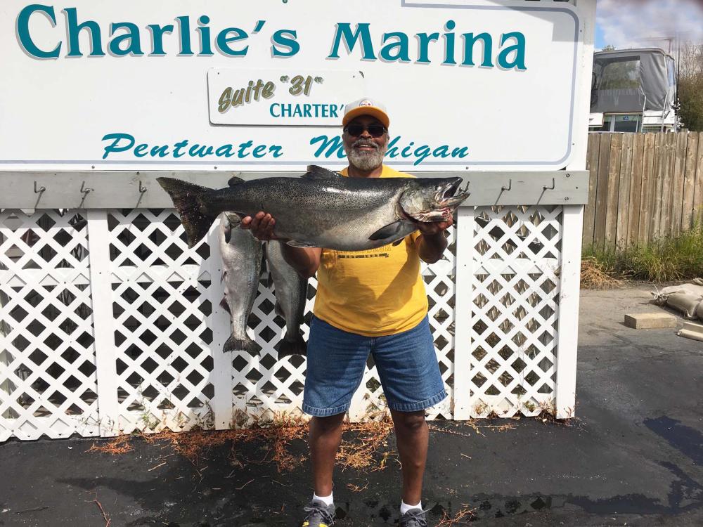Lira Pridgen, former Operation Manager at Peoples, holding his 45lb8oz King Salmon