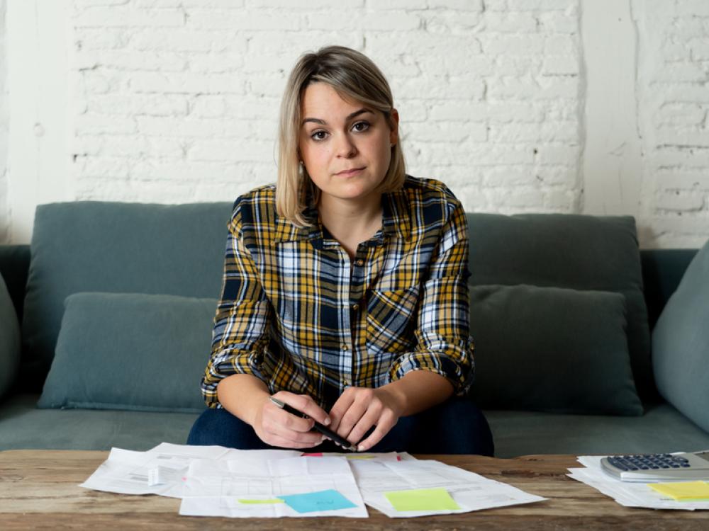 person looking at bills