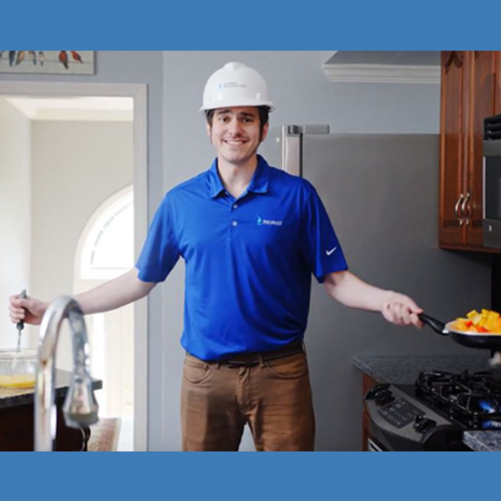 man cooking in hardhat
