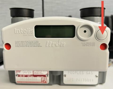 Digital natural gas meter with display screen and control button.